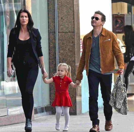 Jeremy Renner with his former spouse and their daughter.